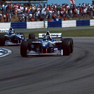 Formula One World Championship: Damon Hill Williams FW18 leads eventual winner team mate Jacques Villeneuve