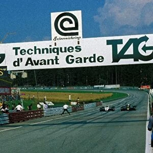 Formula One World Championship: Elio de Angelis Lotus Cosworth 91 and Keke Rosberg Williams Cosworth FW08 accelerate for the finish line side by side