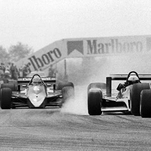 Formula One World Championship: Elio de Angelis Shadow DN9 crashes into the back of Bruno Giacomelli in the new Alfa Romeo 177 on lap 22, forcing
