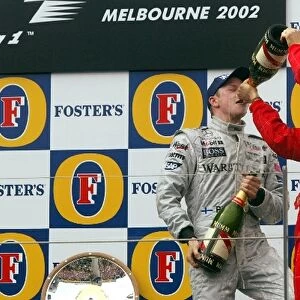 Formula One World Championship: L-R: Kimi Raikkonen, 3rd place, Michael Schumacher, winner
