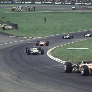 Jackie Oliver leads Siffert, Amon, Stewart and Surtees British Grand Prix