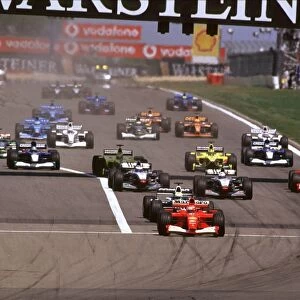 Nurburging, Germany. 22nd-24th June 2001: Michael Schumacher, Ferrari F2001, leads brother Ralf Schumacher, BMW Williams FW23, and Juan Pablo Montoya