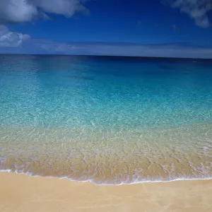 Beautiful Calm Turquoise Ocean From Shoreline To Horizon, Blue Sky With Clouds