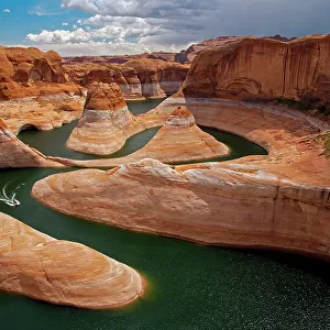 A boat traces the curves of Reflection Canyon, part of Glen Canyon