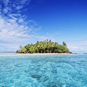 French Polynesia, Tahiti, Turquoise water and blue sky; Bora Bora, Motu Island in Distance
