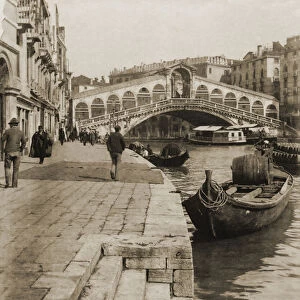 Historic image in sepia of Rialto Bridge over the Grand Canal, Venice, Italy circa 1892; Venice, Italy