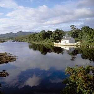 Lackagh River, Creeslough, County Donegal, Ireland; Reflection Of A House In A River