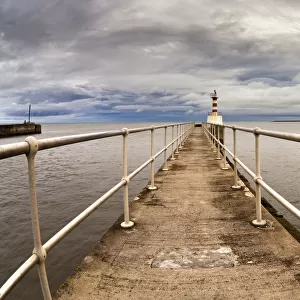 Lighthouse At The End Of A Pier; Amble, Northumberland, England