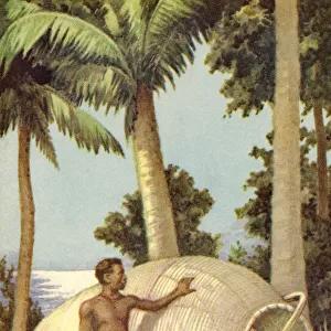A native of Papua New Guinea with a fish trap. From a contemporary print, c. 1935
