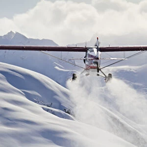 View Of A Super Cub Air Taxi At Tanaina Glacier In The Neacola Mountains, Aleutian Range, Southcentral Alaska, Winter