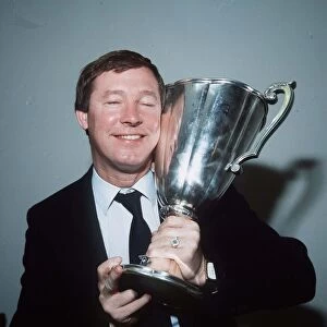 Aberdeen manager Alex Ferguson holding the European Cup Winners Cup trophy after hi side