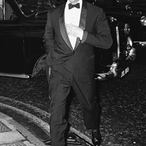 Actor David Niven aarrives at the Prince of Wales Theatre in London for the opening night