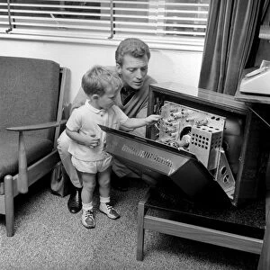 Actor Johnny Briggs at home with his son Mark. Circa 1963