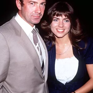 Actor Lewis Collins in September 1988 with his wife at a wedding party at Langans