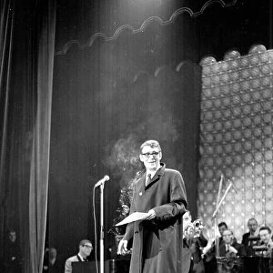 Actor Peter O Toole at Stars Shine for Jack Hylton holding a cigarette on stage