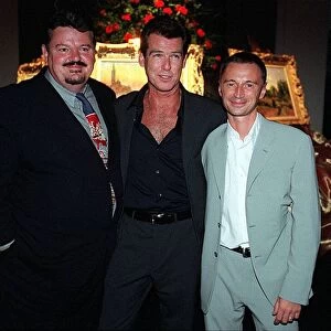 Actor Pierce Brosnan August 1999 with Robert Carlye and Robbie Cotrane at party after