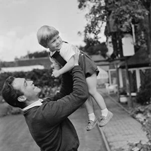 Actor Richard Todd playing with his son Peter at home. 5th November 1954