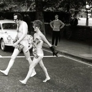 Actors Bill Bailey and Marie Adams crossing Bayswater Road in London naked as they