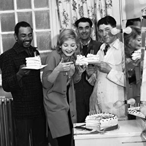 Actress Jill Ireland celebrates her 21st birthday with her co-stars on the set of