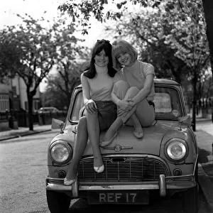 Actress Judy & Sally Geeson outside their home 1967 sitting on Mini motorcar