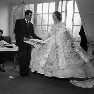 Actress Julie Andrews trying on a dress for her role in the pantomime Cinderella