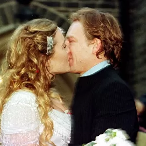 Actress Kate Winslet and Jim Threapleton November 1998 kissing after their surprise