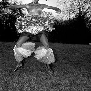 African Dancing: Ghanan Dancers. One of the dancers complete with war paint seen