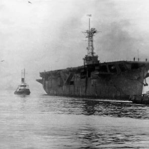 The aircraft carrier HMS Vindex arriving at the River Tyne from Rosyth on her way to her