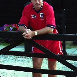 Alan Shearer August 1998 England Football Player standing leaning against fence