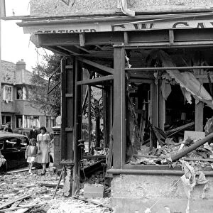 Alfieri. Air Raid damage, Malden. Badly damaged tabacconist. August 16th 1940