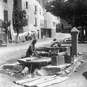 Alfieri Snr. Washing in the street, Gullistre, France. 1st June 1922