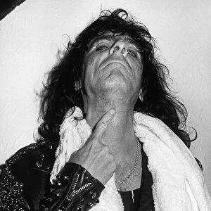Alice Cooper American rock singer shows the marks on his neck after a stage stunt went