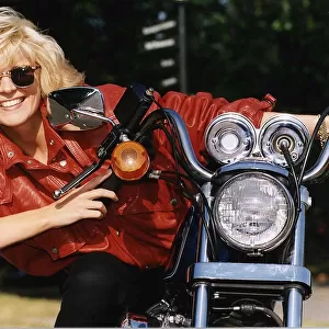 Allison Holloway TV Presenter. Pictured sitting on her Harley Davidson Motorbike