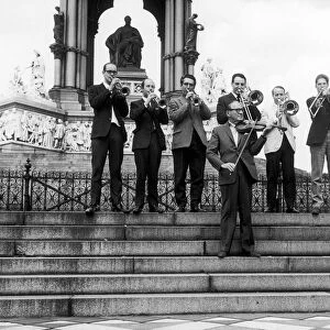 American comedian Jack Benny seeh here tuning up outside the Royal Albert Hall with