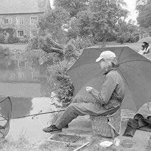 Anglers gathered at Wilfreds Pond near Hose in the Vale of Belvoir