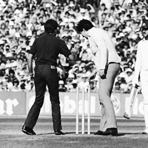 Ashes 1981. Pitch invasion at Old Trafford. Two fans remove the bails in front of a
