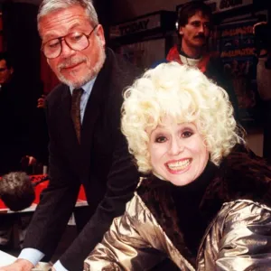 Barbara Windsor and Oliver Reed aftr leaving their palm prints in cement Plaque