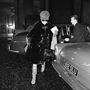 Barbra Streisand, exits car to make her way to stage door entrance at Prince of Wales