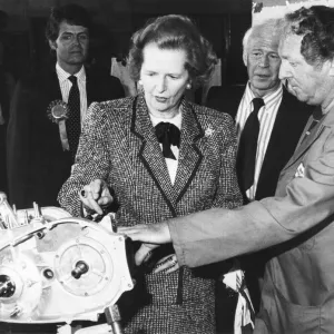 Baronnes Margaret Thatcher accompanied by Patrick Nicholls (left