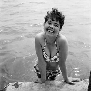 Bathing Girl: Glamour on the Clacton Beach: The cheeky smile belongs to Maureen Kenn, 21