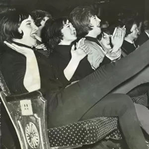 Beatles at the Globe Theatre, Stockton show the fans clapping and screaming
