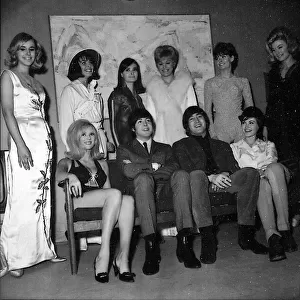 Beatles John Lennon and Paul McCartney backstage with show girls during the Music of