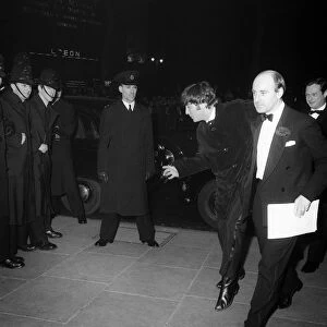 The Beatles March 1964 John Lennon makes some funny moves as the group arrive at