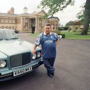 Birmingham City chairman David Sullivan pictured beside his Bently car at his home