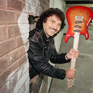 Black Sabbaths Tony Iommi helps to demolish a wall at Musical Exchanges in