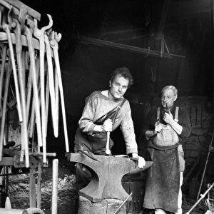 Blacksmith Mr. Kirkup and new apprentice Mr. Garrett at Beamish Museum
