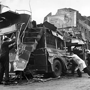 Bomb damage near Waterloo Station. A Blitzed bus caused by blast from a V1 flying bomb