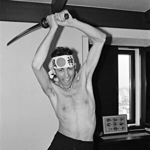 The Boomtown Rats in Tokyo. Pictured, singer Bob Geldof with a sword. May 1980