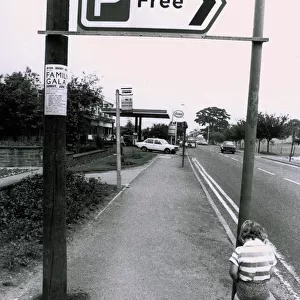A boy urinating on a free parking sign - Pee for free! Humour
