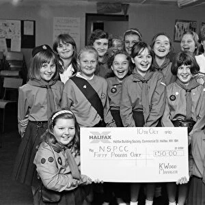Breaking their silence to present 50 to the NSPCC were these Girl Guides